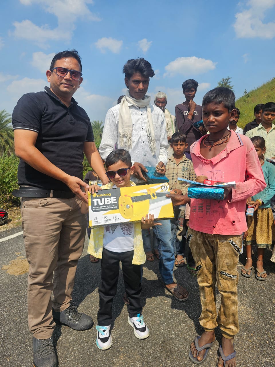 Rural families receiving solar lighting kits